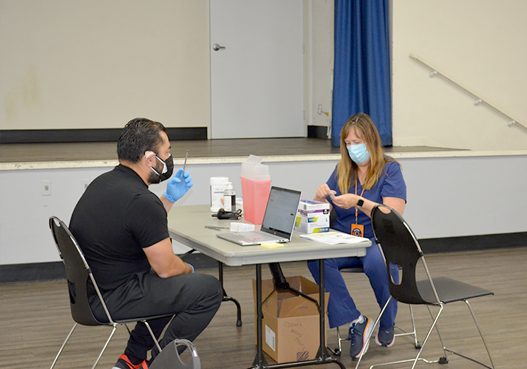 Pharmacist and Technician preparing for vaccine administration