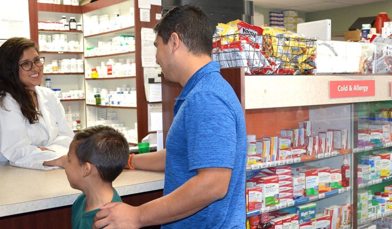 Friendly and knowledgable pharmacist helping customer